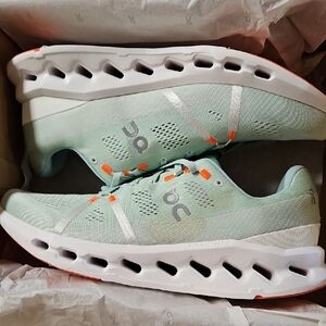 Mint Green Athletic Sneakers with Orange Accents